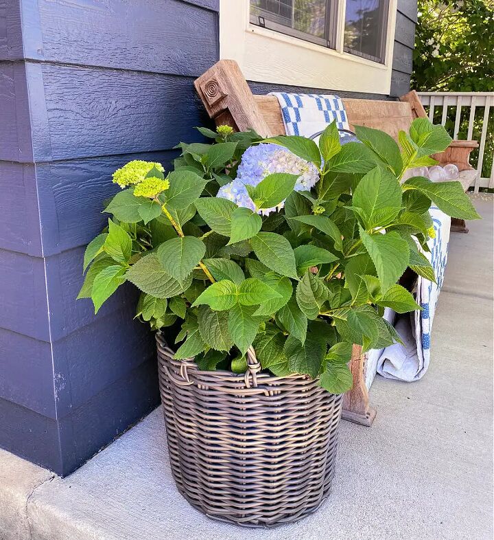 how to use baskets when decorating your home, This outdoor basket on our former porch is perfect for flowers