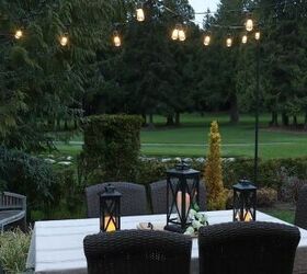 how to make your backyard special with outdoor lighting, outdoor dining table with string lights overhead