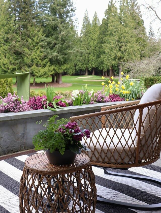 how to make your backyard special with outdoor lighting, woven chairs with side table facing golf course