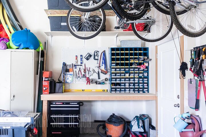 the best tips to an organized and functional garage, Workbench zone garage storage ideas with a repurposed cubbies for small parts like nails screw and bolts Pegboard mounted to the wall holds tools like saws chisels pliers clamps tape measure etc Under the workbench surface if a tool chest shopvac and power tools