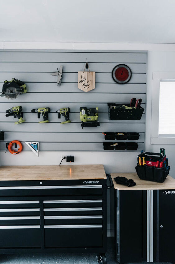 the best tips to an organized and functional garage, Organized Garage ideas for a workshop zone black workbench tool chest with slat wall mounted above storing power tools