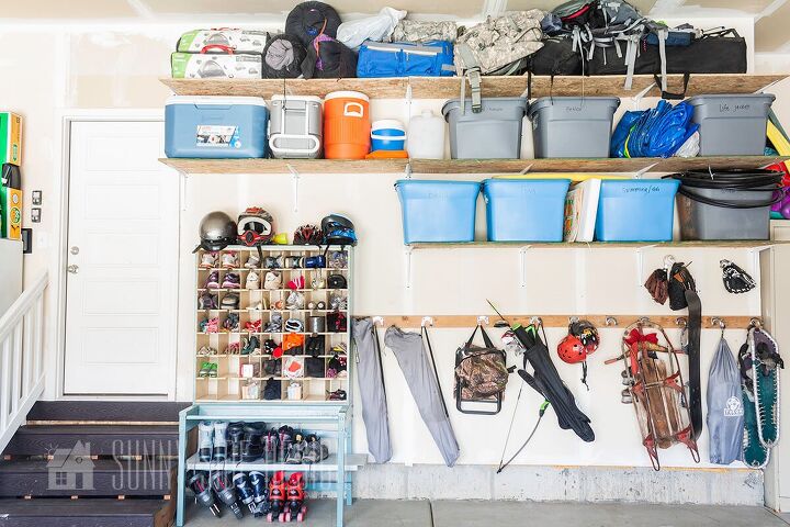the best tips to an organized and functional garage, For an Organized Garage think vertical inexpensive storage shelves mounted to garage wall filled with labeled storage bins camping gear Inexpensive storage hooks from Dollar Tree mounted o 2x4 board with camp chairs and sports equipments An old postal sorter is used to organize shoes boots roller skates and helmets