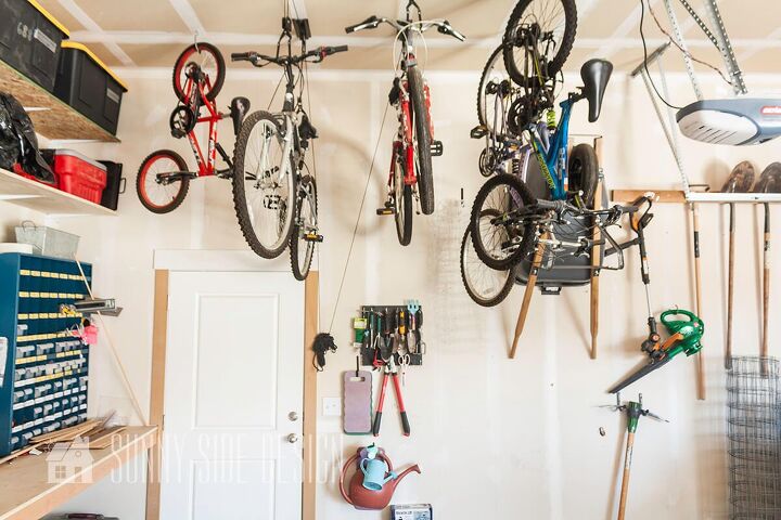 the best tips to an organized and functional garage, Organized garage Bikes are stored with pulley bike hooks and mounted to the ceiling