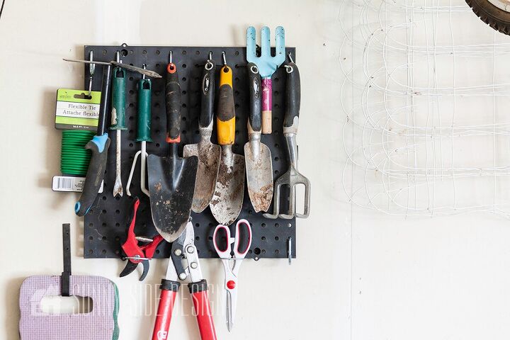 the best tips to an organized and functional garage, Organized garage a small pegboard holds small gardening tools like trowels pruning sheers scissors cultivator and flexible ties