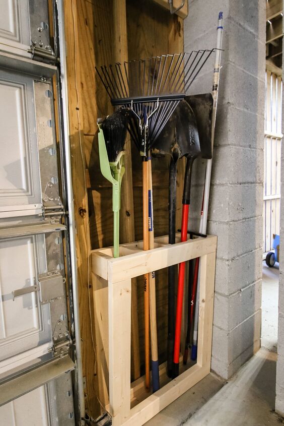 the best tips to an organized and functional garage, Organized garage idea wall mounted DIY storage for broom rake and shovels made out of 2x4s