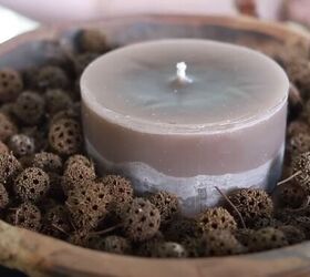 Large dough bowl with a lower flat candle and seed gum pods