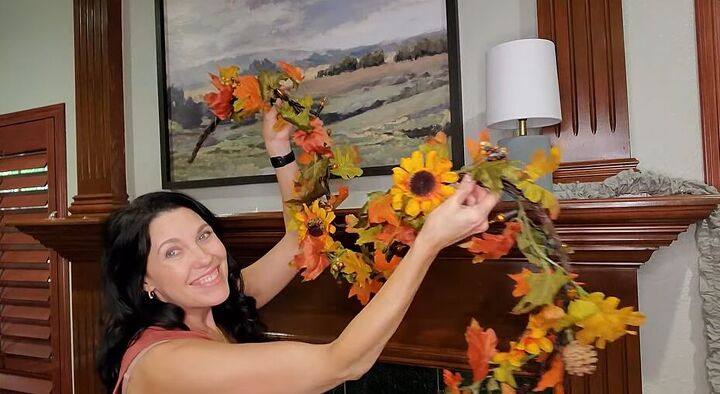 Adding a fall garland to the mantel