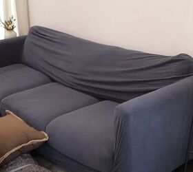 Sofa with a charcoal-bluishcouch cover