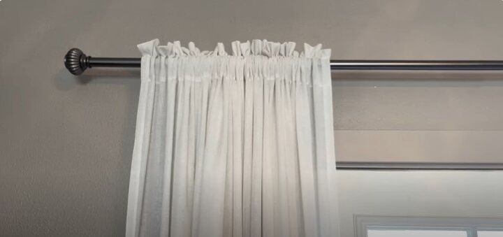 how to make a small home feel bigger, Hanging drapes to make a space feel bigger