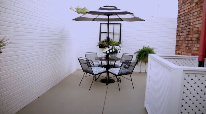 outdoor courtyard, Black and white striped umbrella and outdoor furniture