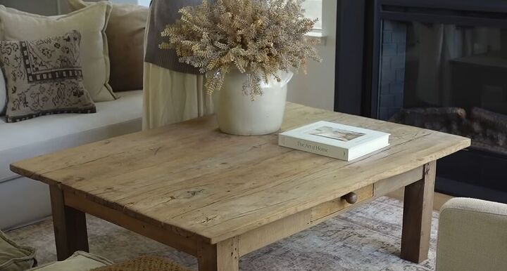 how to style a coffee table, Styling a confit pot on a coffee table with berry stems
