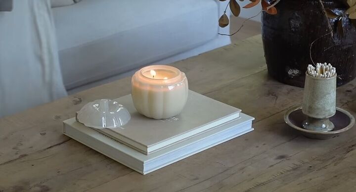 how to style a coffee table, Styling a pumpkin candle