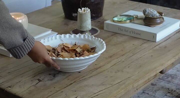 Adding a bowl with leaves to the coffee table