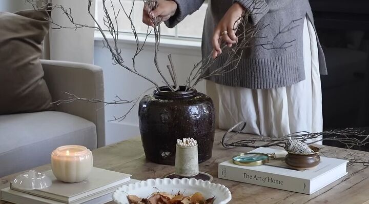 Bare faux branches in a rice jar