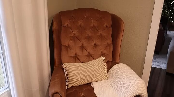 Thrifted chair with a blanket and pillow