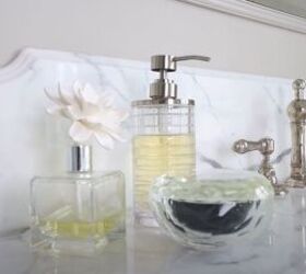 how to make your home look luxurious, Bathroom counter with glass bottles and decanters