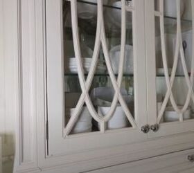 how to make your home look luxurious, Glass front cabinet with all white dishes