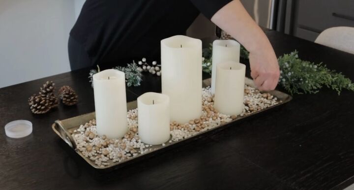 holiday decorating ideas, Positioning the candles among the white pebbles