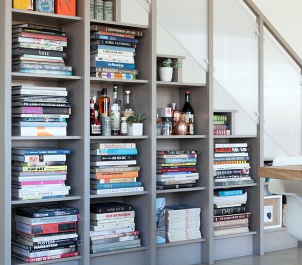 Bookcases and storage under the stairs