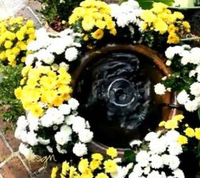 Fountain with flowers around it