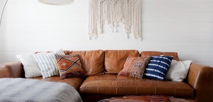 how to decorate boho, Leather sofa with patterned pillows