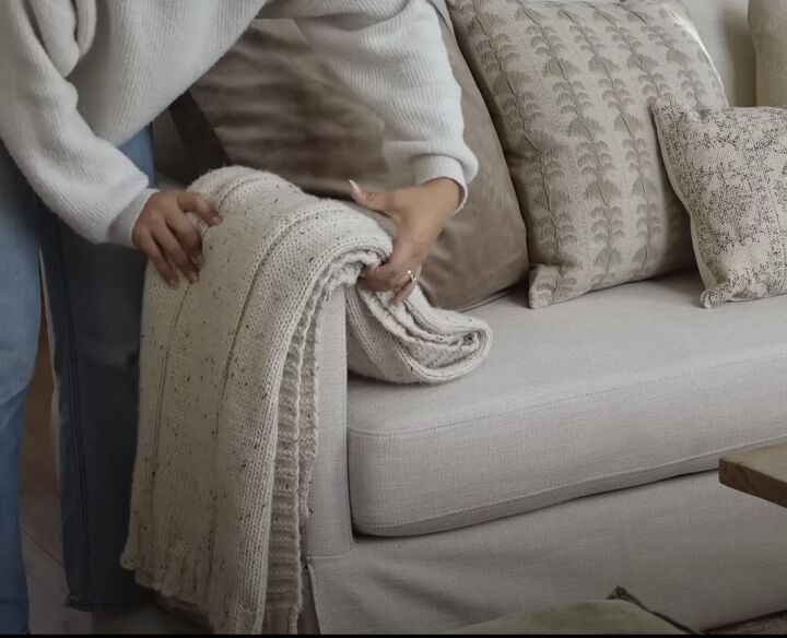 Folded throw blanket on a sofa