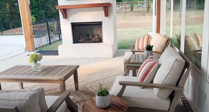 Outdoor patio seating area with a fireplace