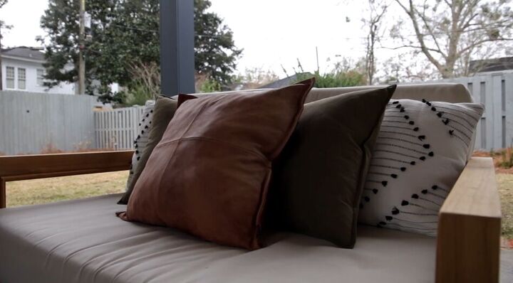 patio makeover, Leather pillow on a sofa