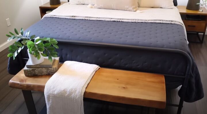 master bedroom tour, Bench with towel books and a plant