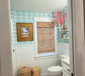 Bathroom with beadboard and wallpaper