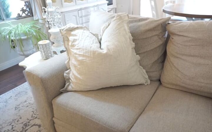 cozy home decor, Adding a big pillow to the sofa