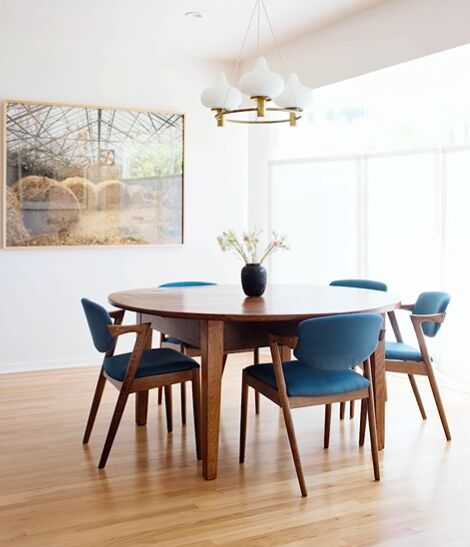 Mid-century modern dining area with a pop of blue