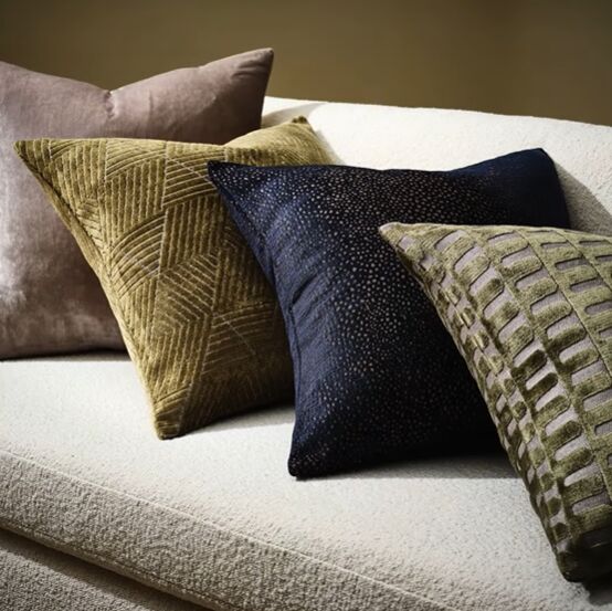 Dark, muted-colored accent pillows