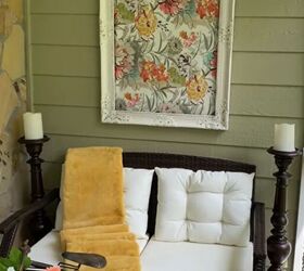 spring porch decor, Tall candleholders either side of a sofa