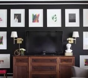 decorating around a tv, Dark accent gallery wall that disguises a TV