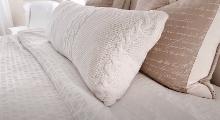 Long lumbar pillow on a bed