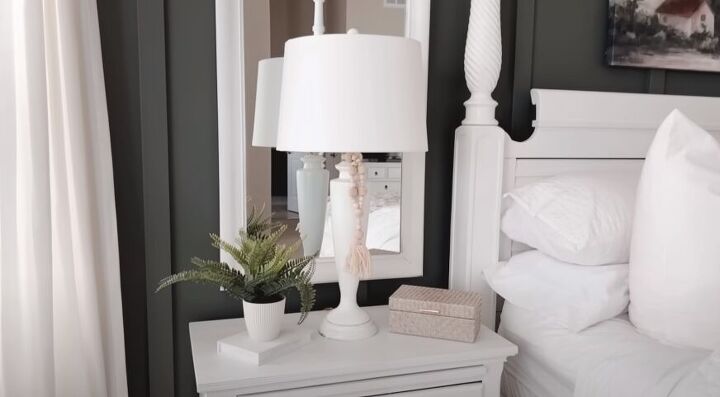 Nightstand with lamp, plant, and box