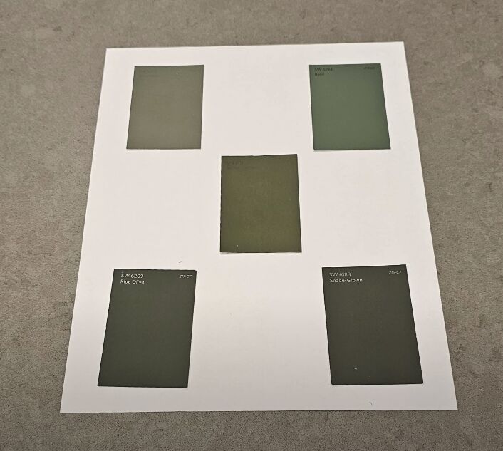 Placing paint samples on white paper first