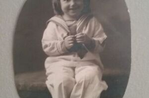 A charming way to display a vintage baby garment